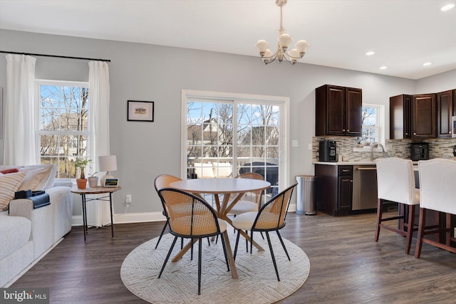 dining area featuring recessed lighting, dark wood-style floors, baseboards, and a chandelier