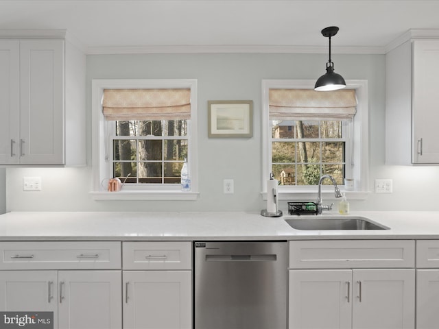 kitchen featuring a sink, white cabinetry, crown molding, and stainless steel dishwasher