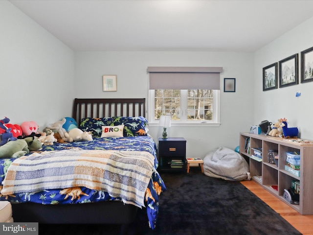 bedroom with wood finished floors