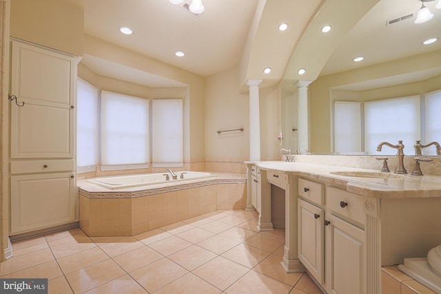 bathroom with visible vents, a sink, a bath, and tile patterned floors