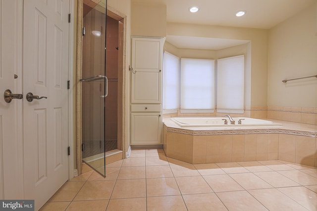 bathroom featuring a shower stall, recessed lighting, a garden tub, and tile patterned floors