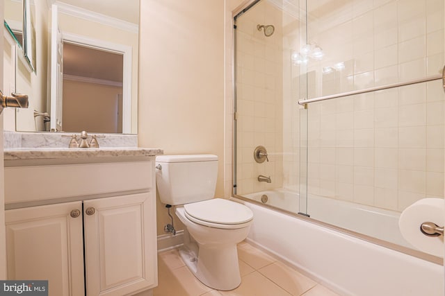 bathroom featuring bath / shower combo with glass door, toilet, ornamental molding, vanity, and tile patterned flooring