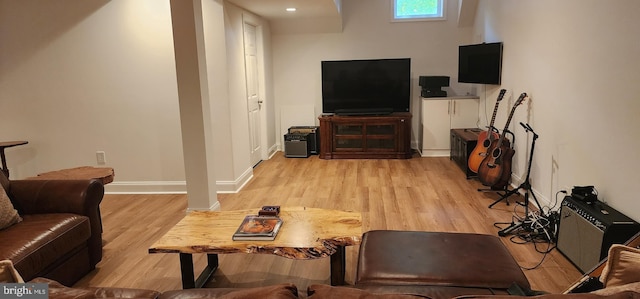 living room featuring light wood-style flooring and baseboards