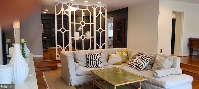 living area featuring an inviting chandelier, wood finished floors, and recessed lighting