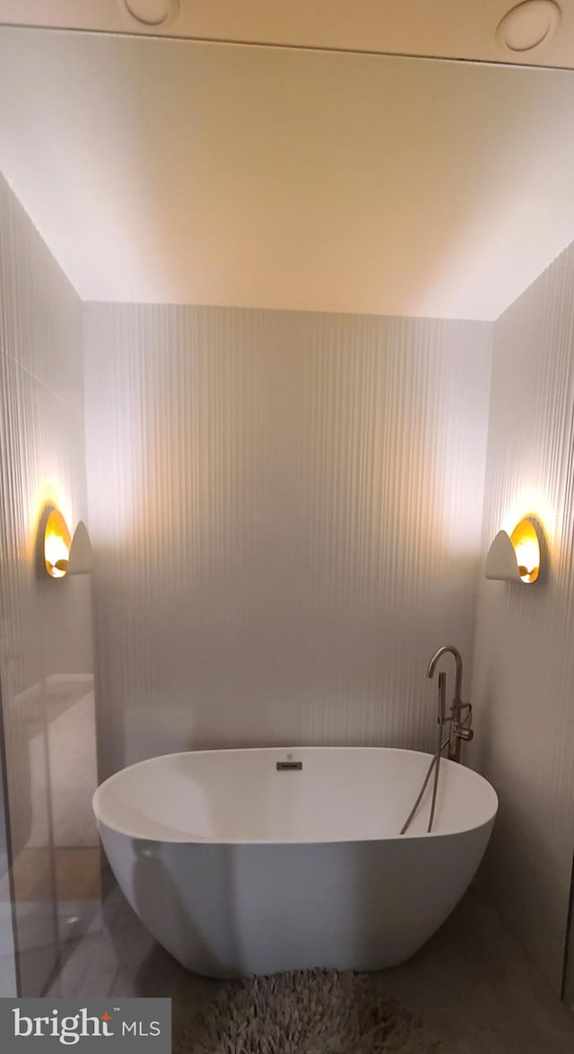 bathroom featuring a freestanding bath