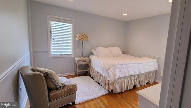 bedroom with light wood-style floors and recessed lighting