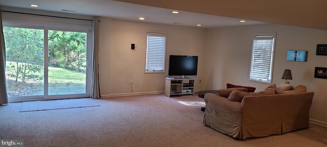 living room with carpet floors, recessed lighting, and baseboards