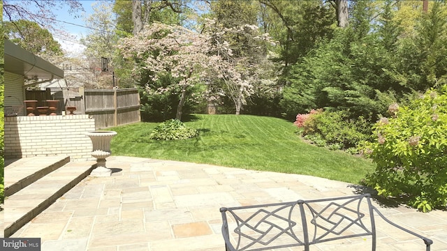 view of patio / terrace featuring fence