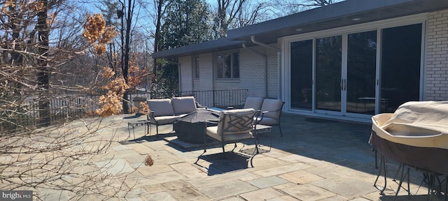 view of patio featuring fence and outdoor lounge area