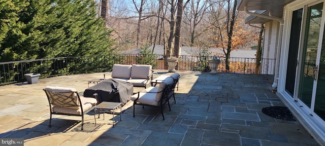 view of patio / terrace with fence and an outdoor hangout area