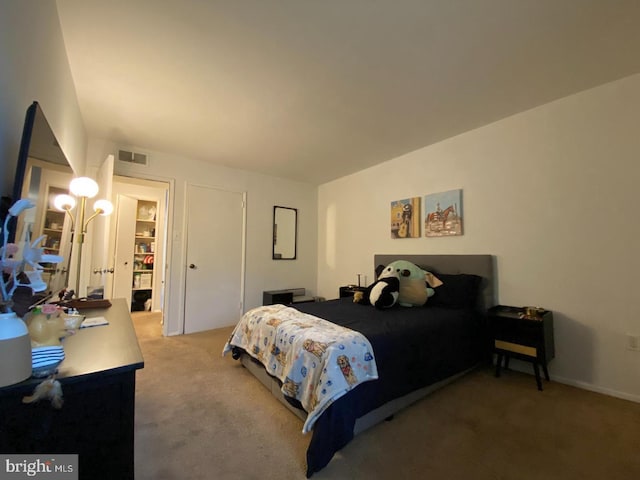 bedroom with carpet and visible vents