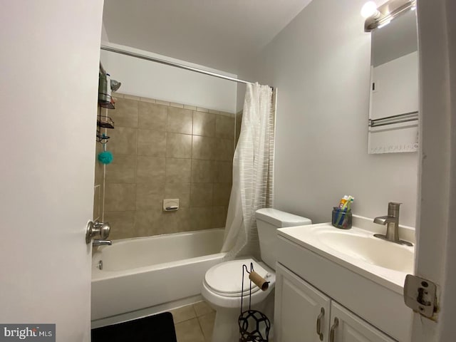 bathroom featuring toilet, shower / tub combo, tile patterned flooring, and vanity