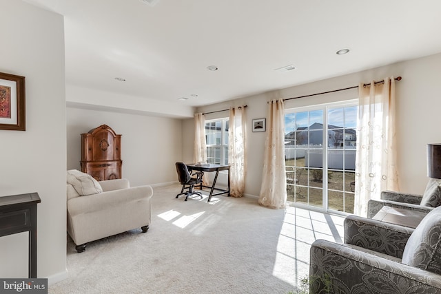 sitting room with carpet floors, recessed lighting, and baseboards