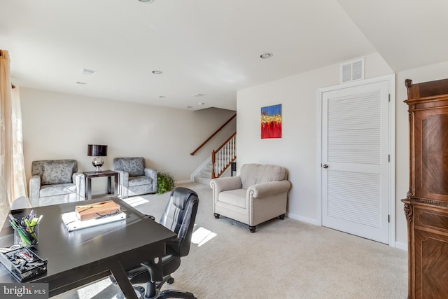 office space with recessed lighting, baseboards, visible vents, and light colored carpet