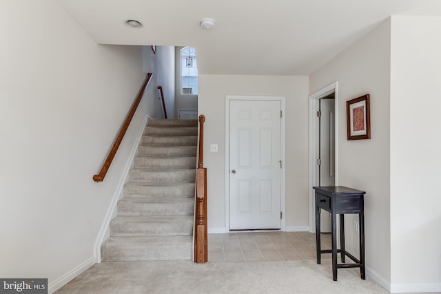 stairs with carpet flooring and baseboards