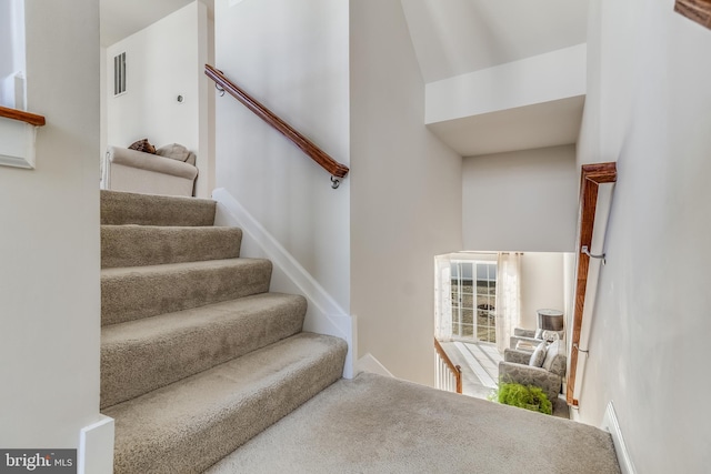 staircase featuring visible vents