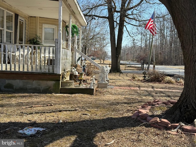 view of yard featuring a porch