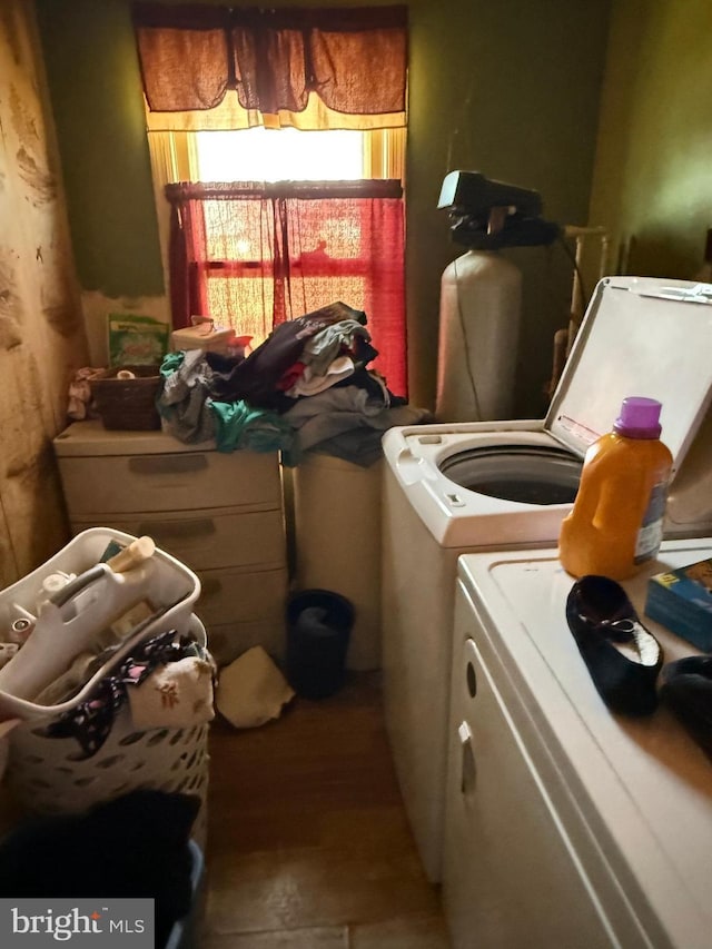 clothes washing area with laundry area and washing machine and clothes dryer