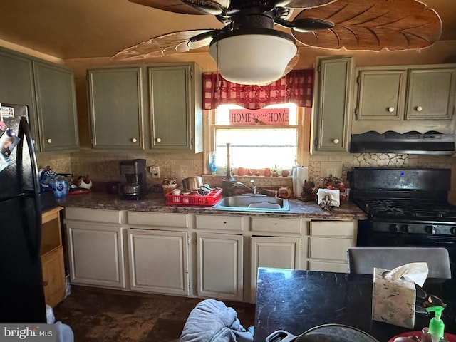 kitchen featuring black appliances, a sink, a ceiling fan, and decorative backsplash