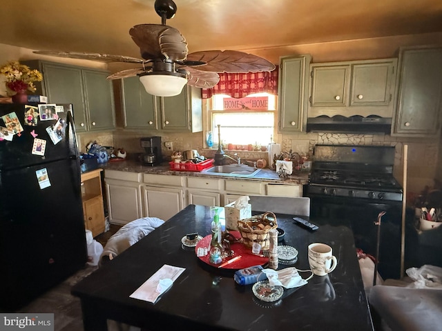 kitchen with black appliances, tasteful backsplash, ceiling fan, and a sink