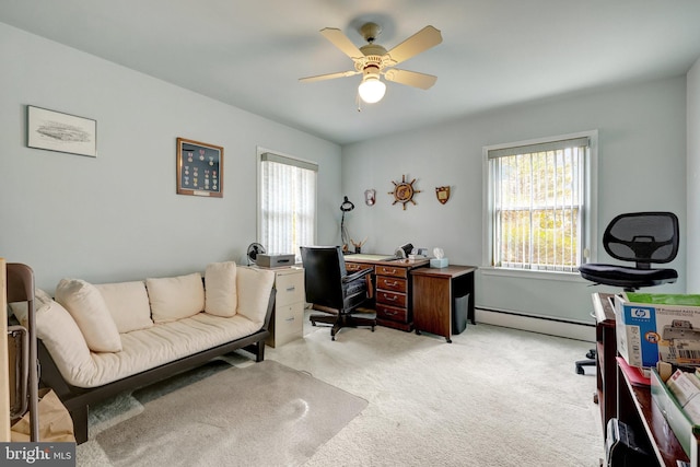 office space with a baseboard heating unit, a ceiling fan, and light carpet