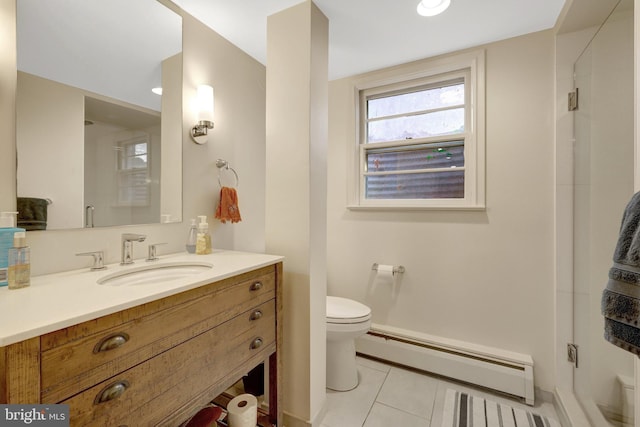 bathroom featuring tile patterned flooring, toilet, vanity, and a baseboard radiator