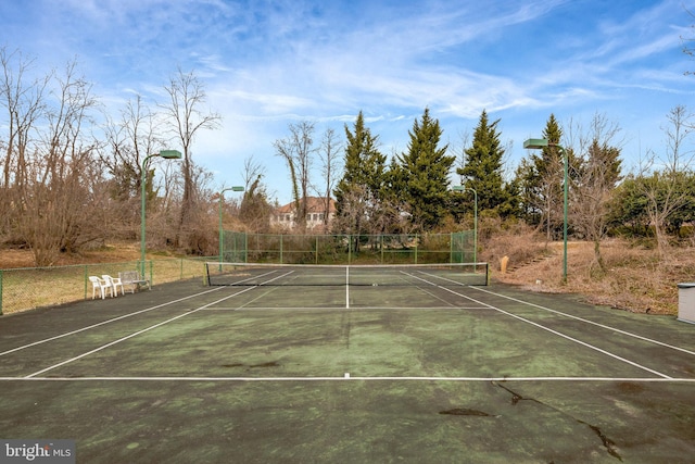 view of sport court with fence