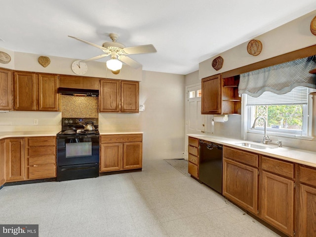 kitchen featuring black appliances, brown cabinetry, extractor fan, and a sink