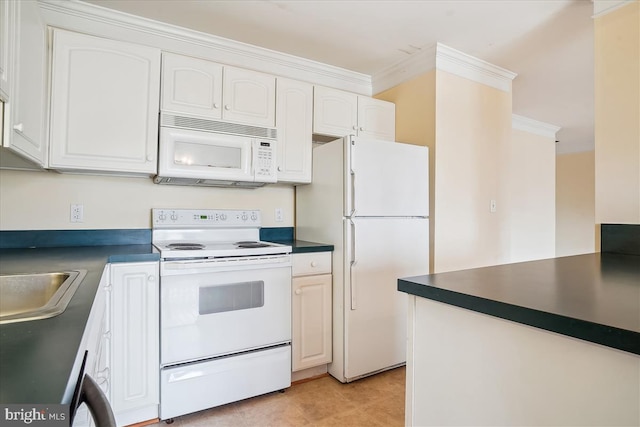 kitchen with white appliances, white cabinets, dark countertops, ornamental molding, and a sink