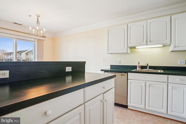 kitchen featuring dark countertops, a sink, visible vents, and stainless steel dishwasher