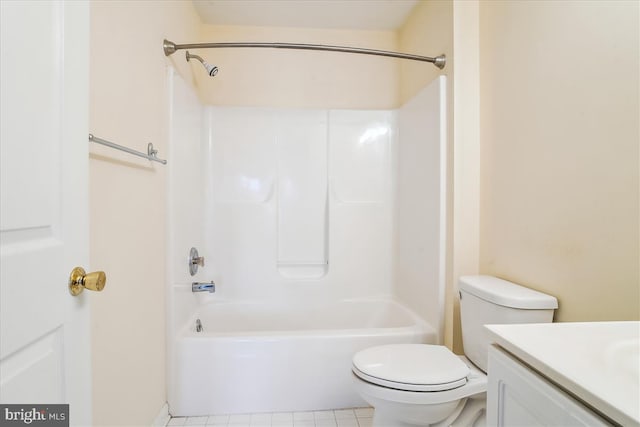 full bath with toilet, tile patterned flooring, washtub / shower combination, and vanity