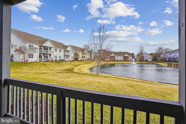 exterior space featuring a water view and a residential view