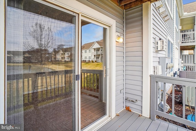 doorway to property featuring a residential view and a balcony