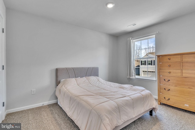 bedroom featuring carpet flooring, baseboards, and visible vents