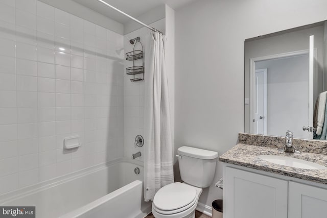 full bathroom with toilet, shower / bath combo with shower curtain, and vanity