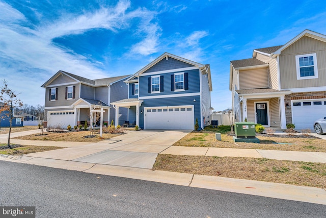 view of front of house featuring concrete driveway and an attached garage