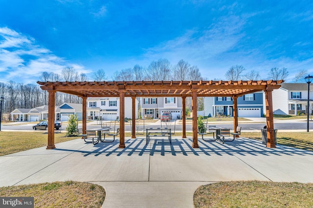 view of home's community with a pergola and a residential view