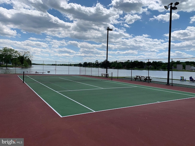 view of sport court with fence