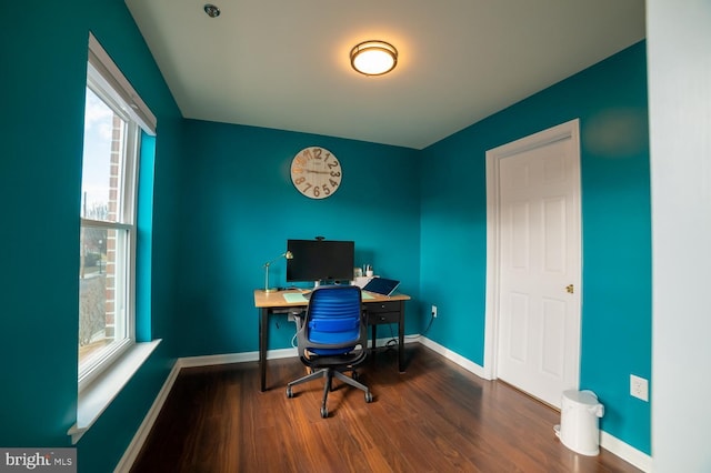 office featuring baseboards and wood finished floors