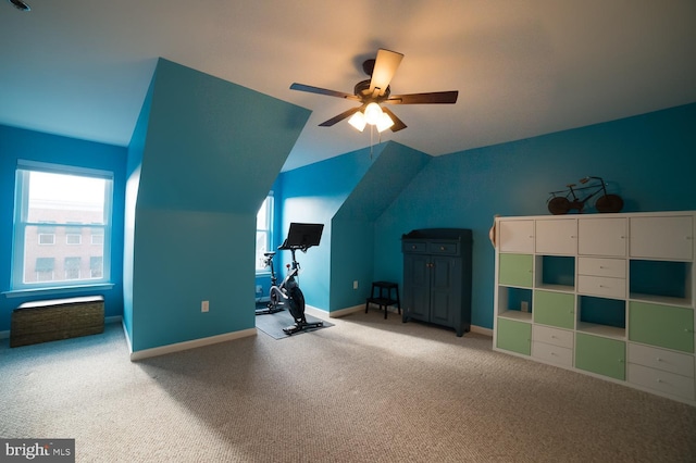 bonus room featuring a healthy amount of sunlight, baseboards, a ceiling fan, and lofted ceiling