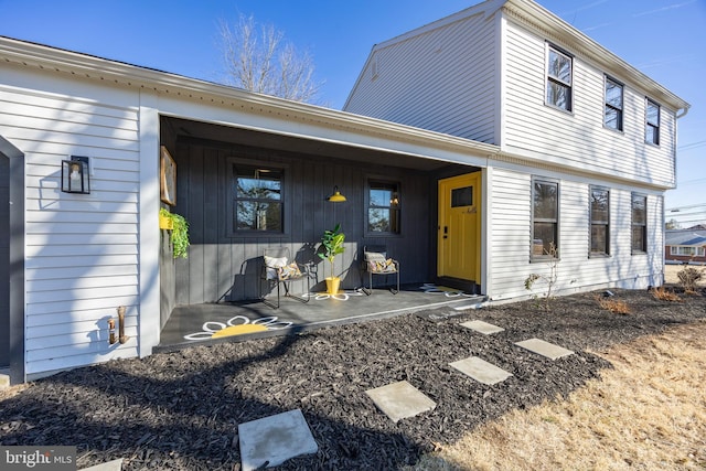 rear view of house with a porch