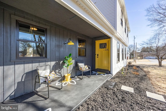 entrance to property featuring board and batten siding