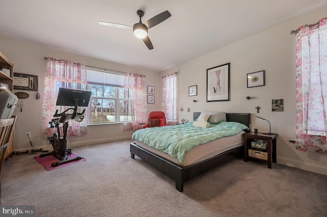 bedroom with carpet, baseboards, and a ceiling fan