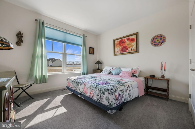 carpeted bedroom with baseboards