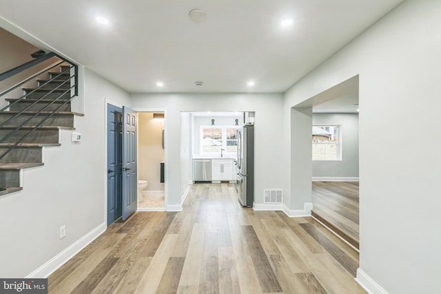 1354 Talbert Ter SE, Washington, DC 20020 - corridor with stairs, light wood-style floors, baseboards, and recessed lighting