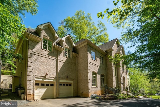 1347 Kirby Rd, Mclean, VA 22101 - view of side of home featuring brick siding and driveway