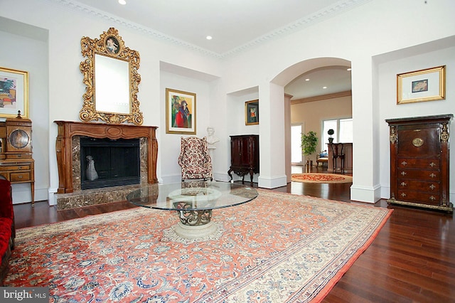 1347 Kirby Rd, Mclean, VA 22101 - living room with baseboards, crown molding, wood finished floors, arched walkways, and a premium fireplace
