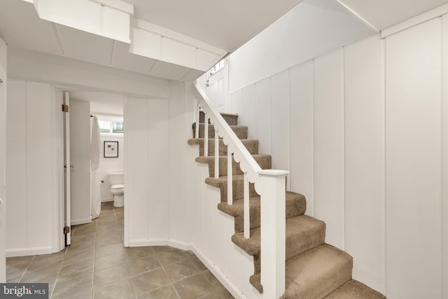 stairs with tile patterned floors