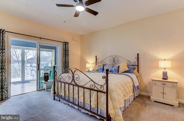 bedroom featuring light colored carpet, visible vents, ceiling fan, access to outside, and baseboards