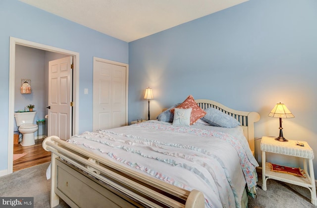 bedroom with a closet and carpet flooring